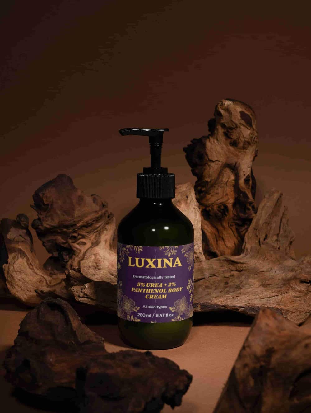 LUXINA urea body cream bottle on wooden surface with warm brown background